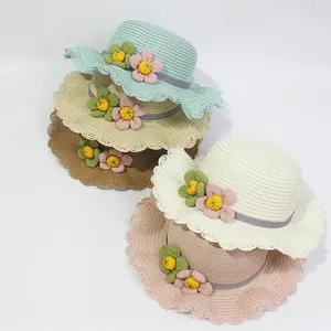 Kids summer straw hats with flower decor and wave brim in assorted pastel colors