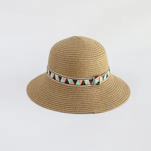 Child sun straw hat with wide brim and geometric patterned ribbon for outdoor activities