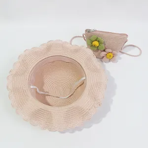 Pink straw sun hat and matching crossbody bag set with floral decorations for girls