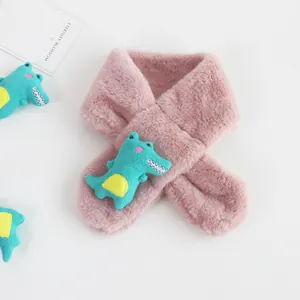 Close-up of pink faux rabbit fur toddler scarf with a 3D blue cartoon crocodile detail