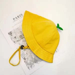 Detail of yellow cotton kids bucket hat with sprout decor and adjustable drawstring