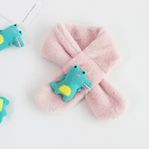 Detail of pink faux rabbit fur kids scarf with a cute green dinosaur plush ornament