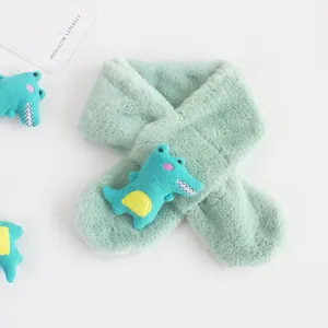 Detail of soft plush light green kids scarf with cute blue cartoon crocodile doll attachment