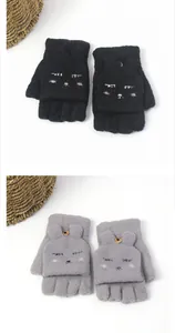 Detail of knitted convertible flip top gloves with cute animal embroidery and buttons