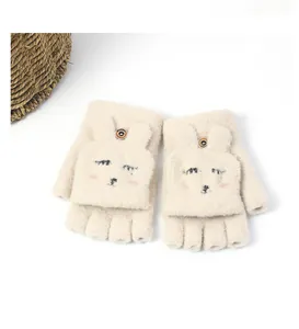 Detail view of cream plush flip-top gloves with cute bunny embroidery and button detail