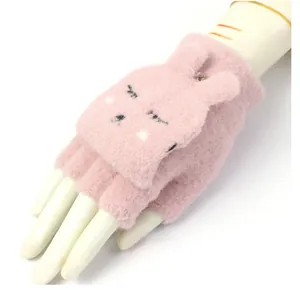 Detail of pink plush flip-top gloves showing the cute embroidered bunny and soft texture