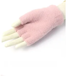 Detail view of pink knitted half-finger gloves showing soft texture and high elasticity