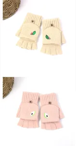 Detail of knitted convertible flip gloves with cute fruit embroidery and buttons