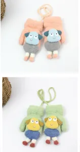 Detail of plush fleece mittens with cute cartoon sheep design and neck cord for toddlers