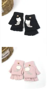 Detail of knit flip top gloves featuring cute cartoon cat patterns and button closure