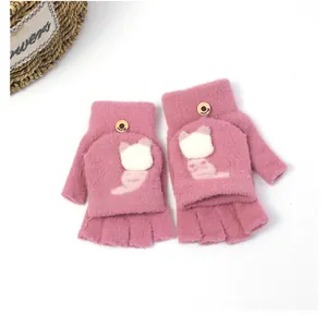 Detail of pink knitted flip-top gloves with soft plush fur and cute cat embroidery