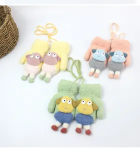 Detailed view of three pairs of plush sheep mittens with colorful long neck cords