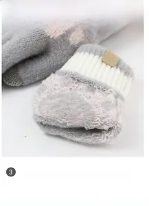 Detail of elastic windproof cuffs and thickened warm lining on knitted cat paw gloves