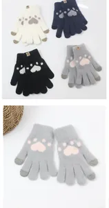 Close-up of knit gloves with cat paw prints and contrasting fingertips in four colors
