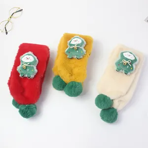 Thick plush Christmas socks for kids with green tree decor and cozy fur balls