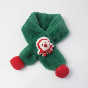 Detail of green plush kids Christmas scarf with Santa Claus applique and red pom-poms