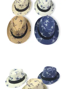 Detailed pattern of palm tree prints on straw fedora hats for beach vacations