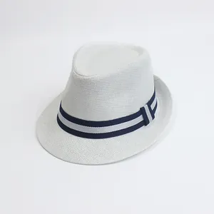 Detailed view of white woven fedora hat with blue and grey striped ribbon band