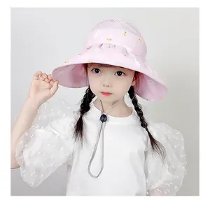 Close-up of pink sun hat featuring breathable mesh top and cute cartoon rabbit print