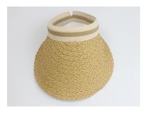 Close-up of woven raffia sun visor with elastic striped band and wide brim detail