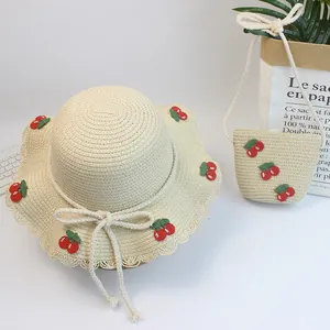 Kids wide brim straw sun hat and matching bag set with cute cherry crochet details
