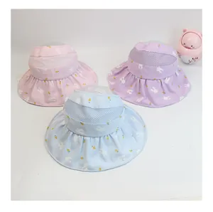 Detail view of breathable mesh kids sun visors with pink, purple, and blue floral patterns