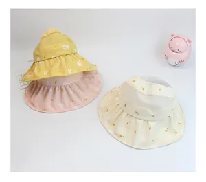 Detail view of foldable sun hats for girls featuring cute bunny and carrot patterns
