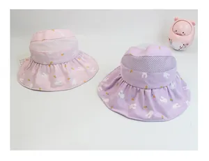 Detail view of pink and purple sun hats with mesh breathability and cartoon prints