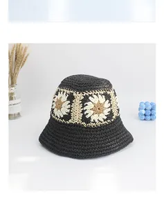 Close-up of black crochet straw bucket hat with delicate sunflower embroidery details