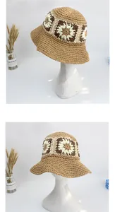 Detail of handmade woven straw hat featuring vintage sunflower crochet patterns and textures
