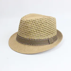 Close-up of breathable mesh hollow weave and striped ribbon on khaki straw fedora hat