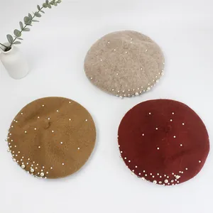 Wool berets in beige, camel, and burgundy with pearl and rhinestone details
