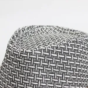 Macro detail of breathable mesh weaving pattern on the crown of a summer fedora sun hat
