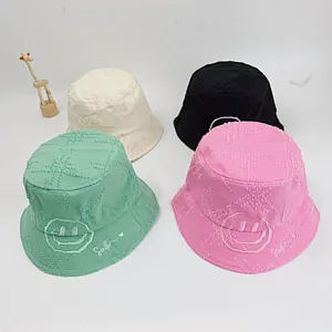 Embroidered smile face cotton bucket hats for kids in green pink white and black colors
