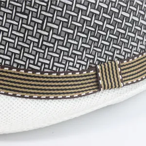 Detailed close-up of breathable mesh texture and striped ribbon on summer fedora hat