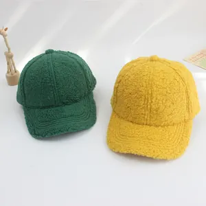 Plush kids baseball caps in yellow and dark green for autumn and winter warmth