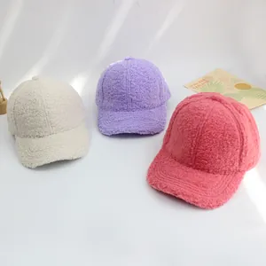Detailed view of winter lamb wool baseball caps in cream, lavender, and coral pink colors