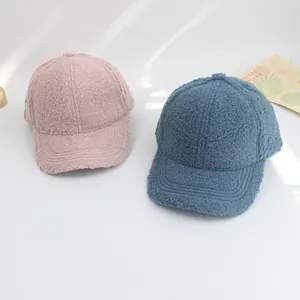 Detailed view of soft lamb wool baseball caps in pink and blue for kids winter wear