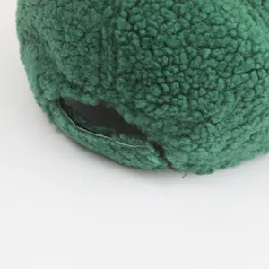Detail of green lamb wool baseball cap showing soft texture and adjustable back strap