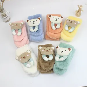 Flat lay view of colorful plush bear scarves for children in multiple soft pastel tones