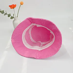 Hot pink cotton bucket hat with breathable mesh lining and raw fringe edge detail