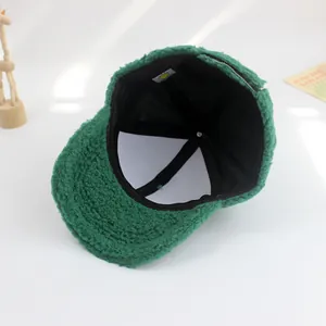 Dark green sherpa baseball cap with warm lining and adjustable strap for kids
