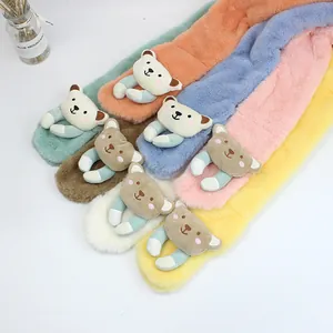 Detailed close-up of colorful plush children scarves with cute 3D cartoon bear decor