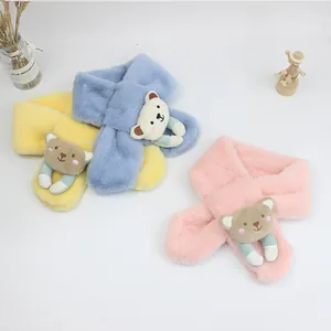 Detailed view of plush kids' scarves in yellow, blue and pink with cute bear decor