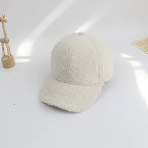 Detailed texture of off-white sherpa baseball cap for kids with warm plush material