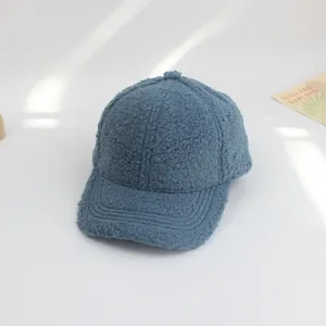 Detailed close-up of blue lamb wool baseball cap texture with reinforced brim stitching