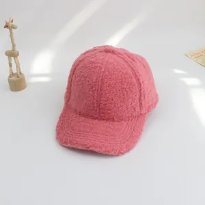 Detailed view of pink lamb wool baseball cap for kids with a soft fleece texture