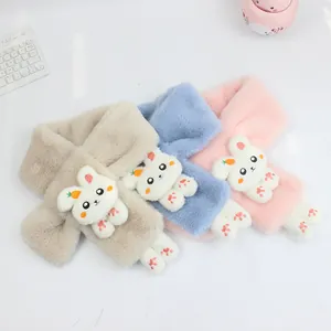 Close-up of fluffy plush children scarves in beige, blue, and pink with cute bunny decor