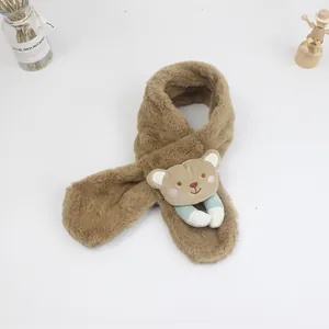 Detail of plush brown baby scarf with a 3D cartoon bear and soft fuzzy texture