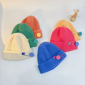 Kids knitted beanie hats with smile pin in multiple colors like orange blue and green